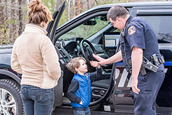 Deputy Sampson assisting a child